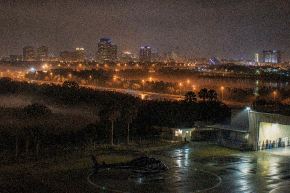 City lights spread across the Orlando skyline at night from a high vantage point