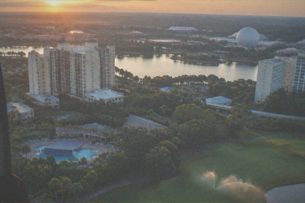 Resort hotels and palm-lined roads of the Lake Buena Vista area seen from a low-flying helicopter