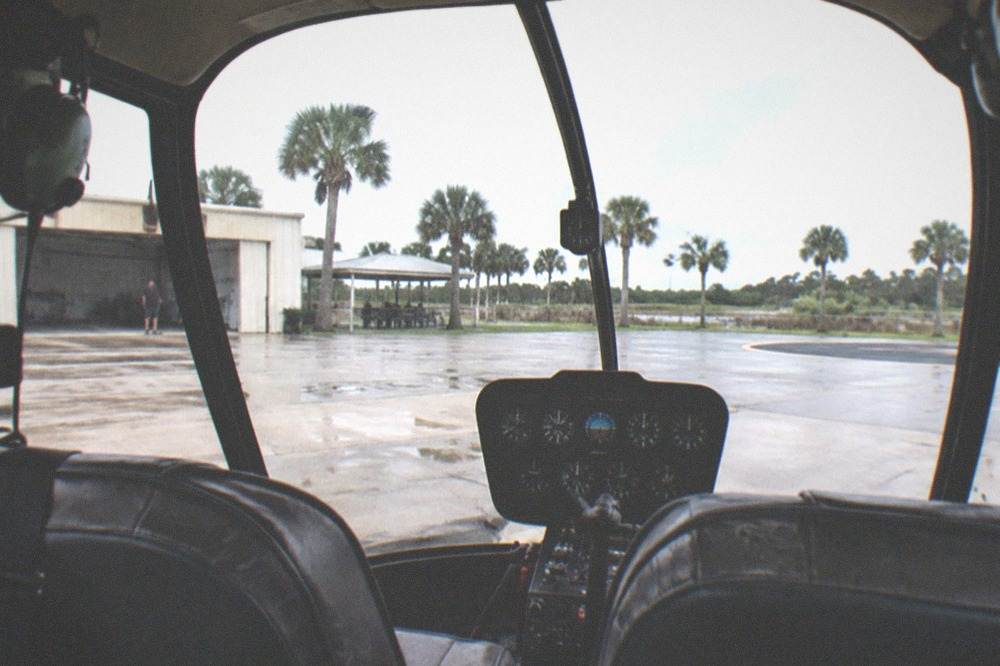 Robinson helicopter interior showing large windows and forward passenger seats