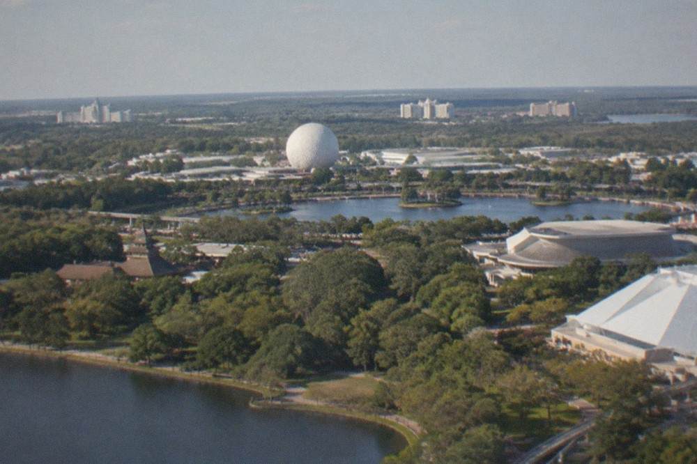Aerial view of the Walt Disney World resort area skyline seen from a helicopter at a distance